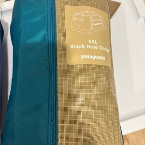 Patagonia Teal and Tan 55L Black Hole Duffel